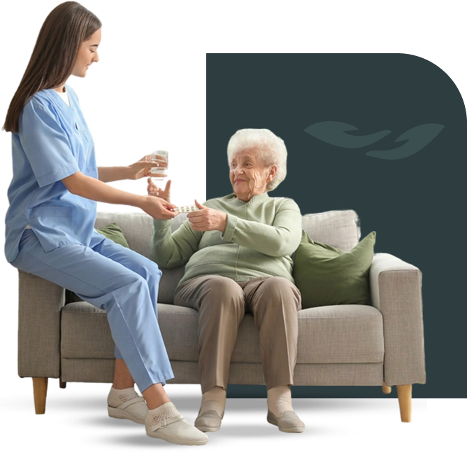 Caregiver giving medication to senior woman
