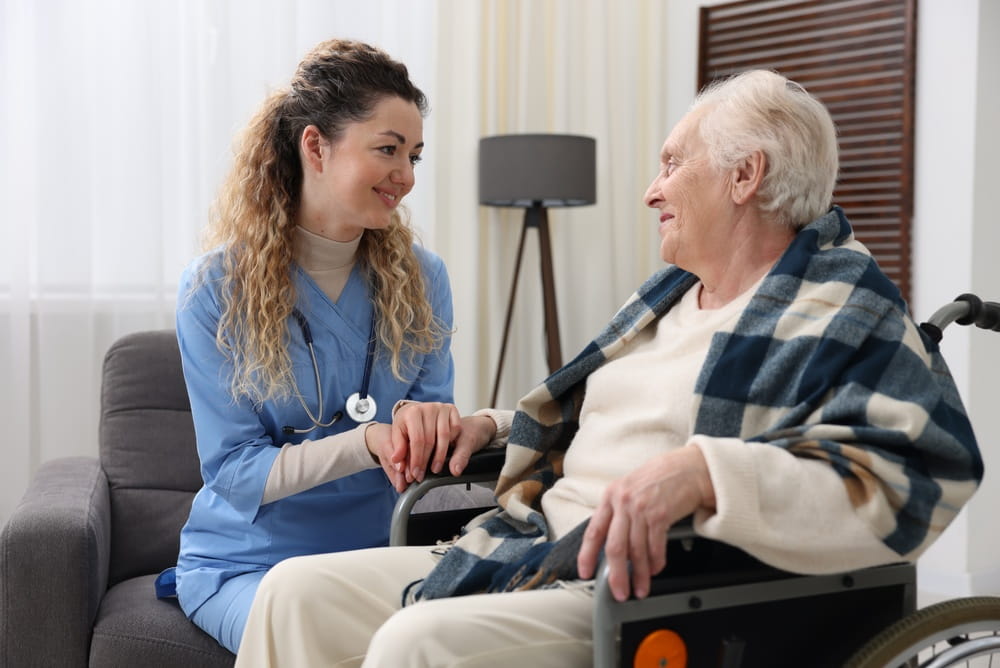 Caregiver with senior woman in wheelchair